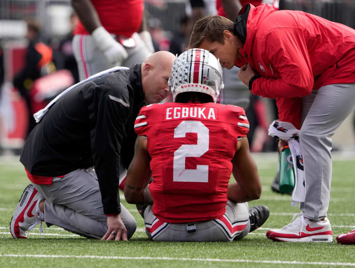 Ohio State Buckeyes wide receiver Emeka Egbuka (2) is attended to on the field during the second half of Saturday's NCAA Division I football game against the Maryland Terrapins at Ohio Stadium